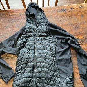 Black puffy jacket / light arms vest look